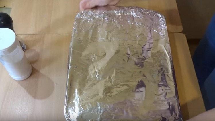 Cover the form with foil and send to the oven.