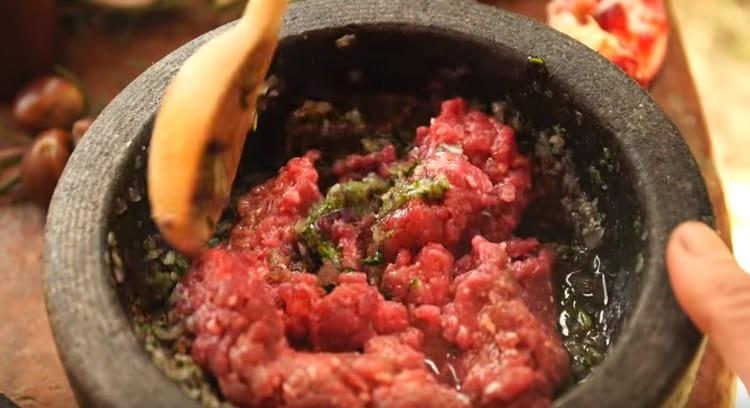 Combine the minced meat with onion, cilantro, and spices.