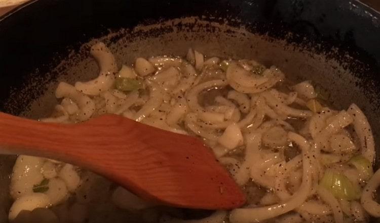 Add garlic to the onion, as well as spices.