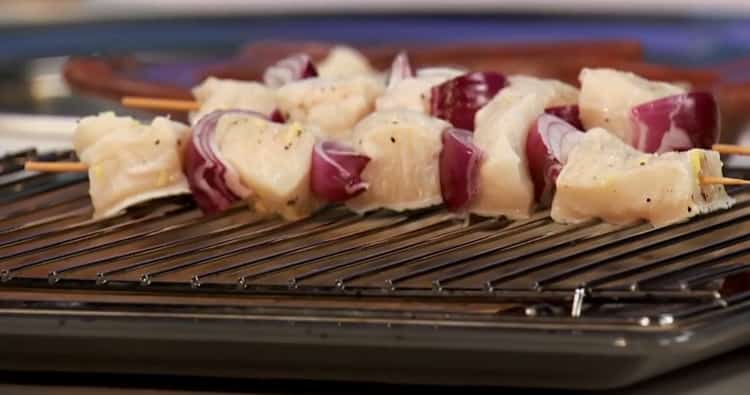 To prepare catfish in the oven, put the skewers on the wire rack.