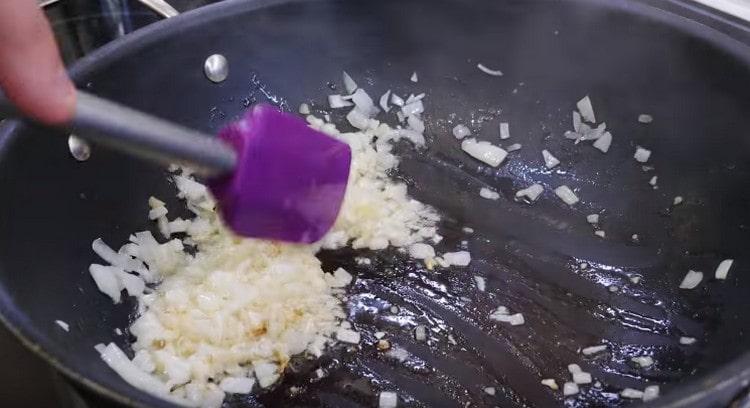 Fry the onions until transparent.