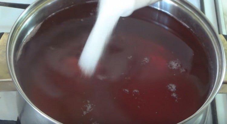 Pour sugar into a saucepan and bring the syrup to a boil.