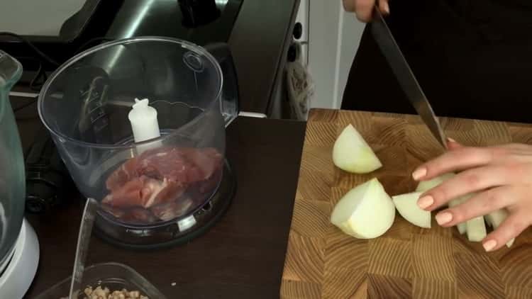 To prepare buckwheat cutlets, chop onion and meat