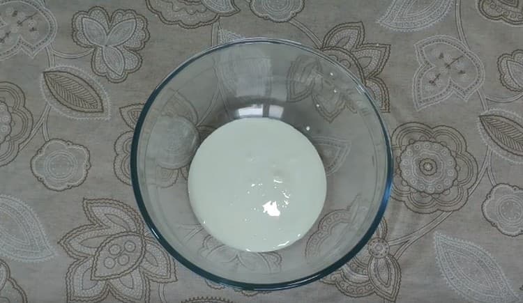 Pour chilled cream into the whipping container.