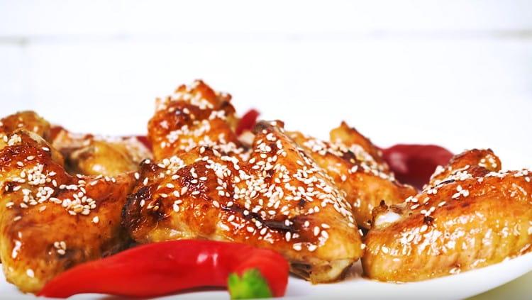 Chicken wings in honey and soy sauce can also be sprinkled with sesame seeds.