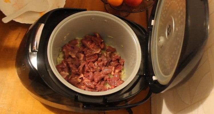 Add hearts to the onion in the multicooker.
