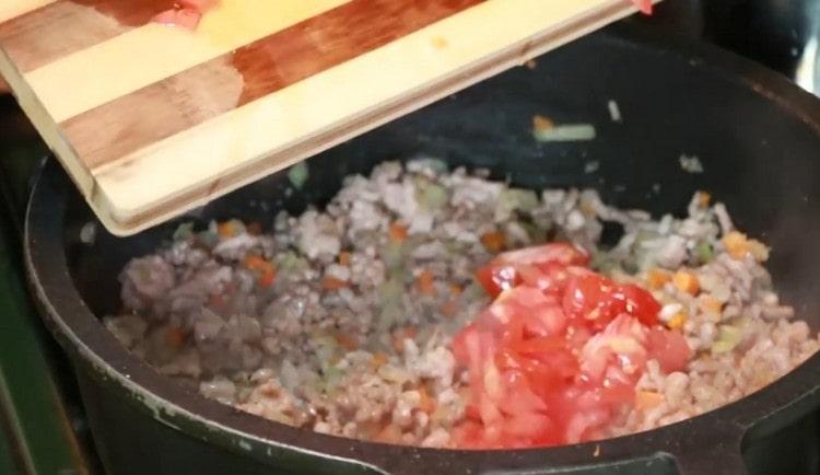 Add finely chopped tomatoes.