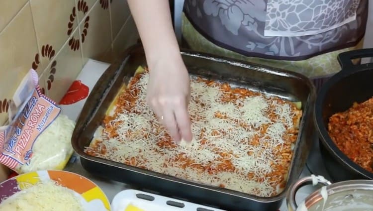 Sprinkle this layer with grated cheese.