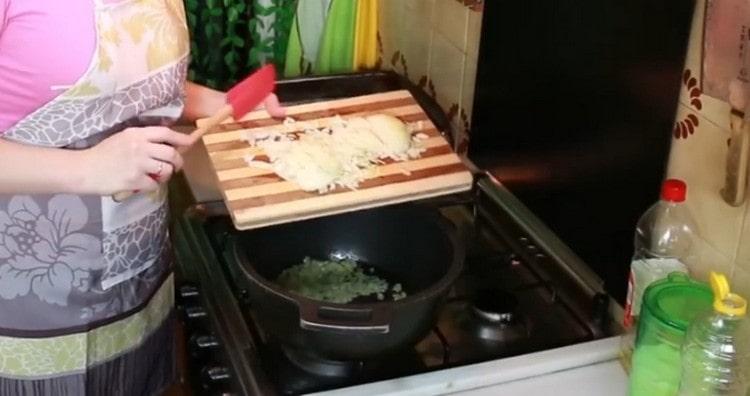Add chopped onion to celery.
