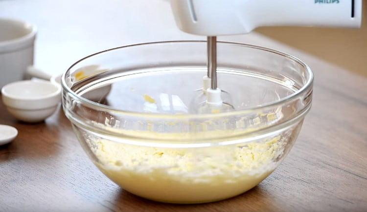 Beat butter with sugar with a mixer.