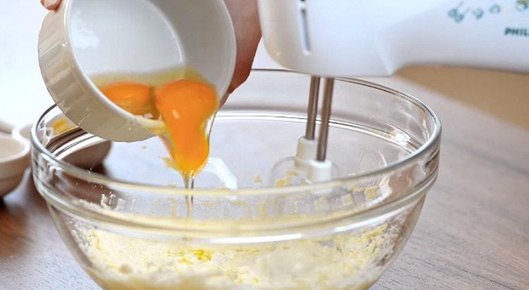 One by one we introduce eggs into the oily mass.
