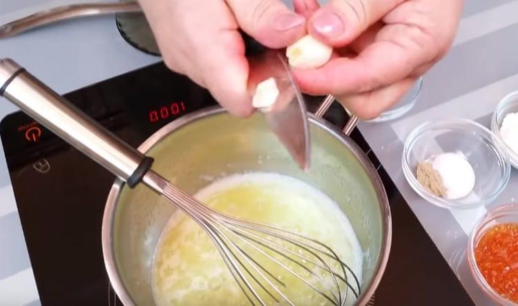 Cut a clove of garlic into a creamy mass.