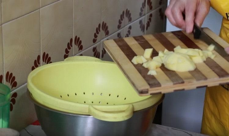 Put the potatoes in a colander to get rid of excess fluid.