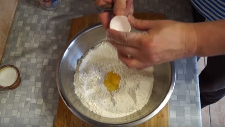 We beat the egg into the flour.