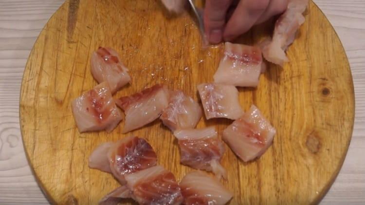 Cut the peeled pollock into pieces.