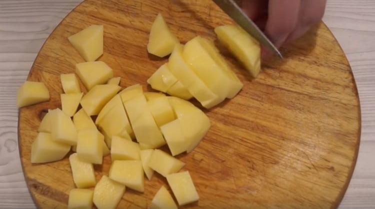 cut potatoes with cubes.