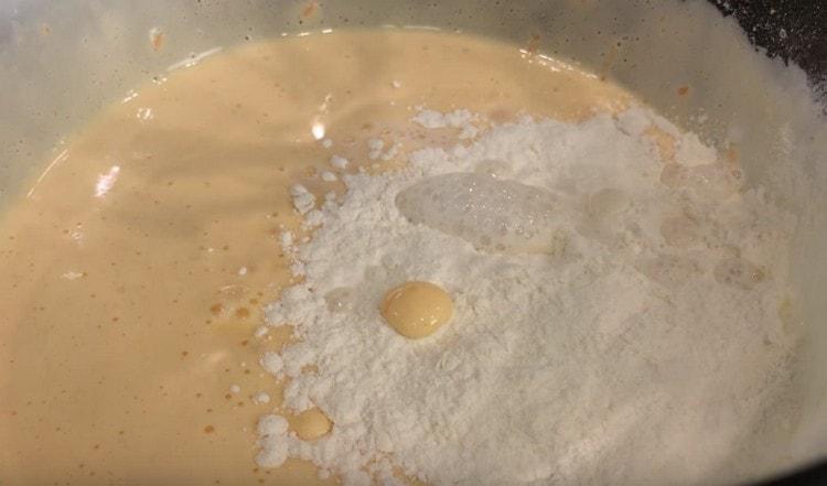 Add the remaining flour, soda to the dough and mix again.