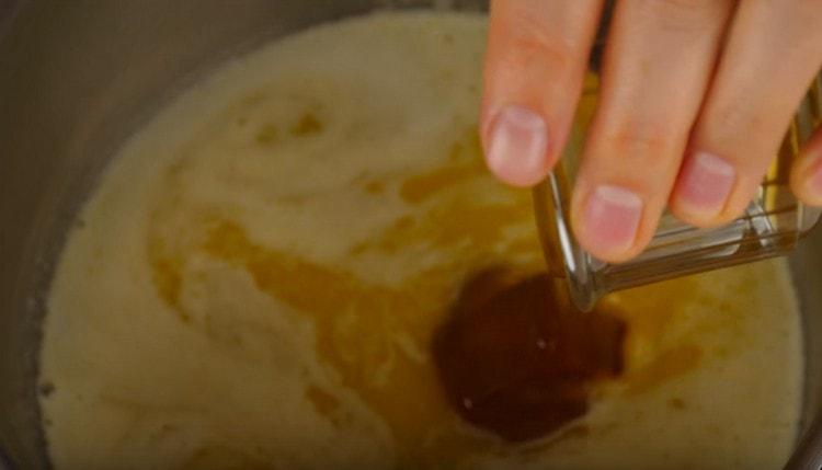 To the melted butter add water and honey.