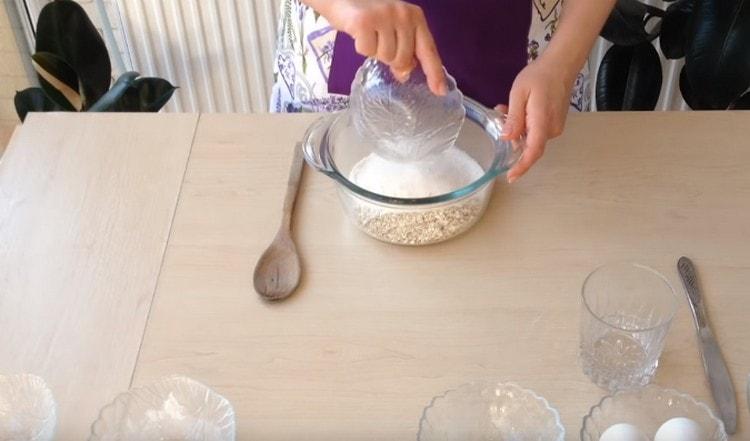 Combine oatmeal, flour and sugar in a bowl.