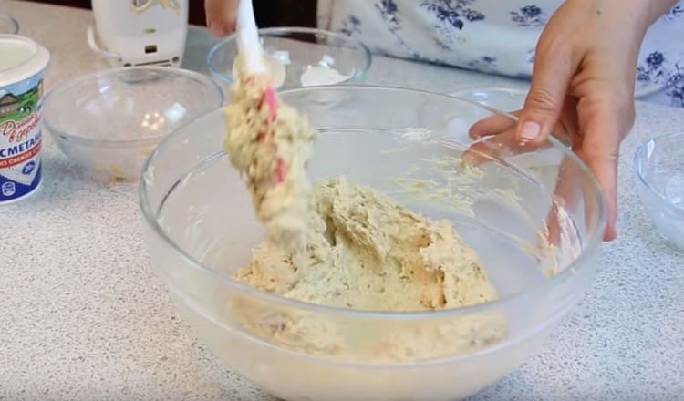 Gently mix thick sticky dough.