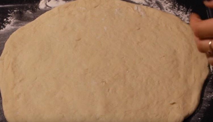 divide the dough in half. roll out one half.