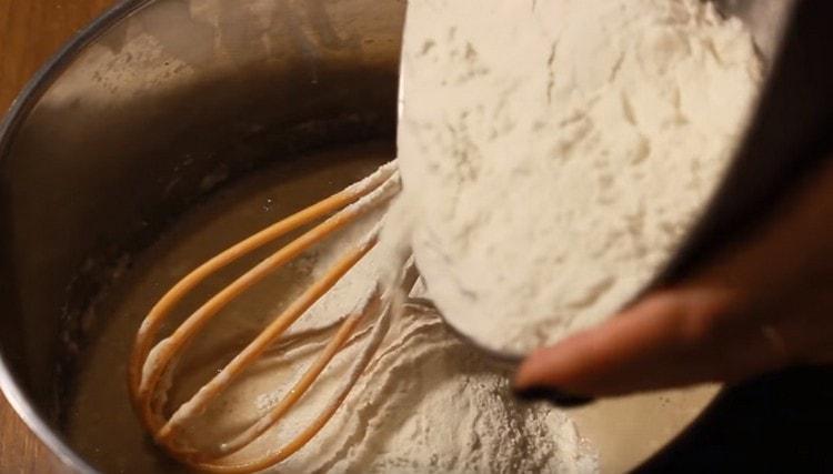 Add the flour a little and knead the dough.