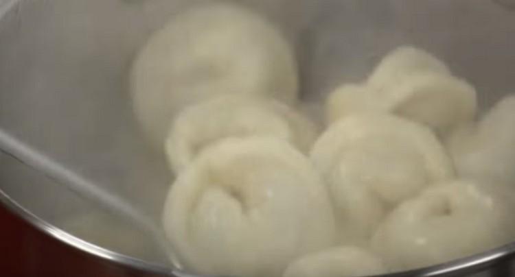 Boil dumplings until cooked in salted water.