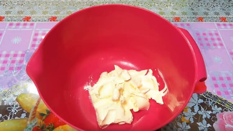 Spread softened margarine in a bowl.