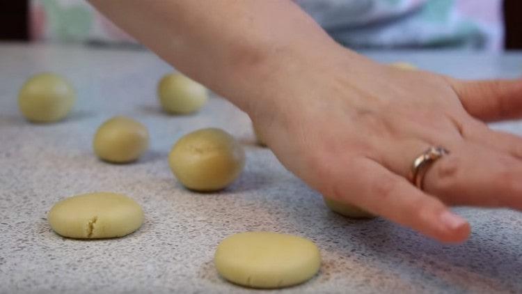 For hats, we roll the pieces of dough into balls and squeeze them by hand.