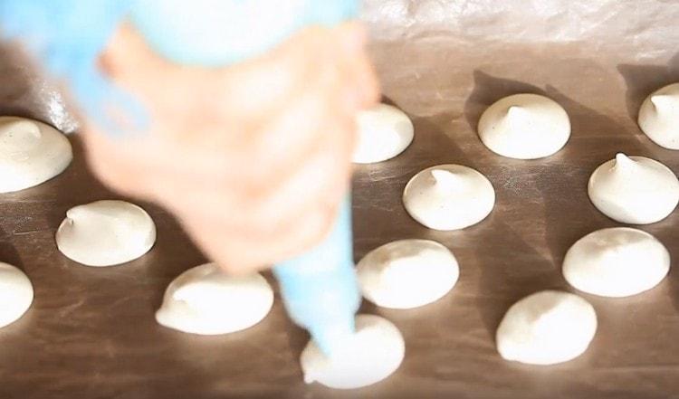 We set cookies on a baking sheet covered with parchment.