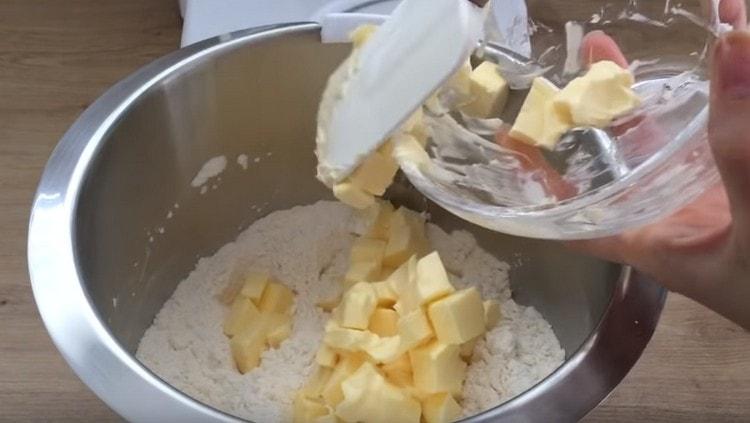 Add softened butter to the flour.