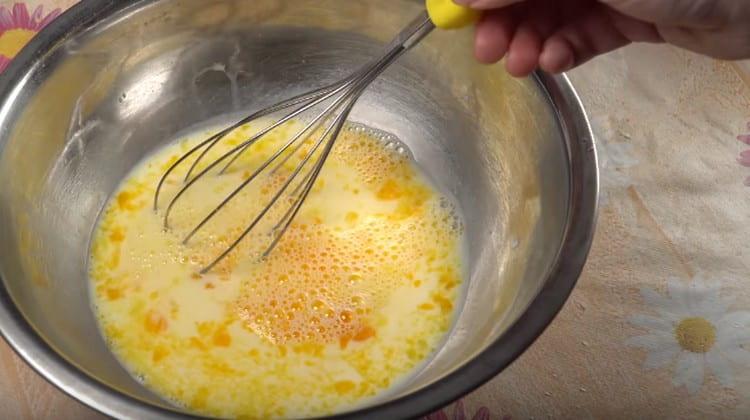 Mix egg yolks with milk.