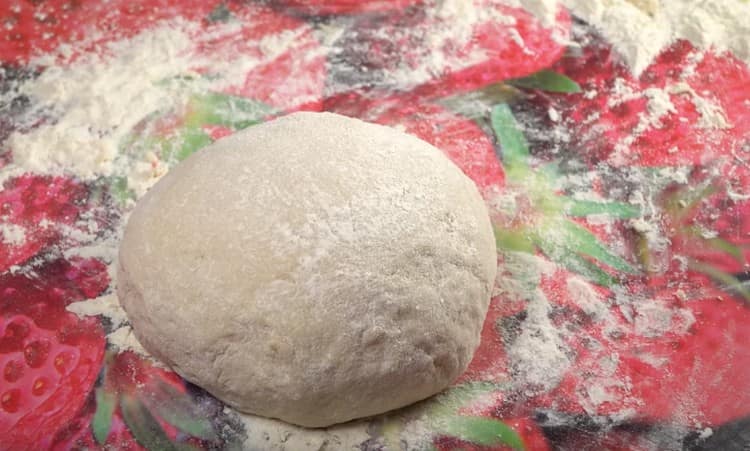Add flour to the liquid components and knead a fairly tight dough.