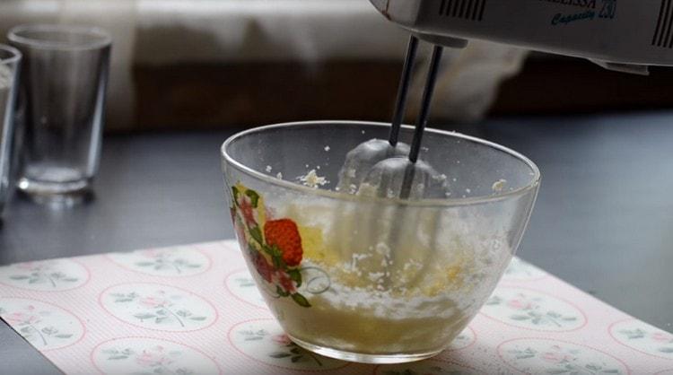 Beat butter with sugar with a mixer.