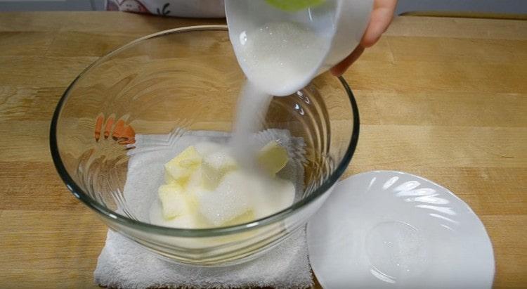 Add sugar to softened butter.