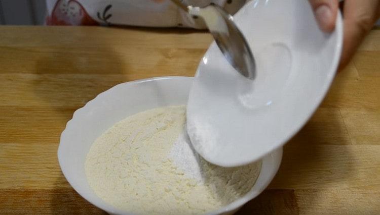 Mix the baking powder with flour.