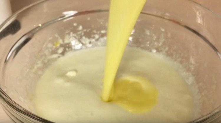 Introduce the melted butter into a lush mass.