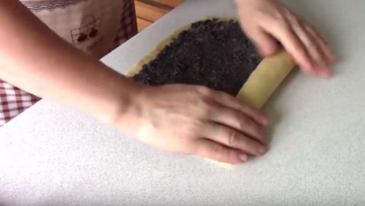Gently roll the dough into a roll.