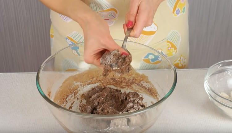 We mix the dough with a spoon first, and then proceed to kneading with your hands.