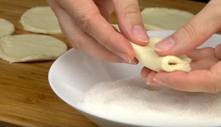 Fold a circle of dough in half.