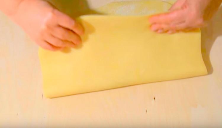Now we fold the glued layers of dough in half.