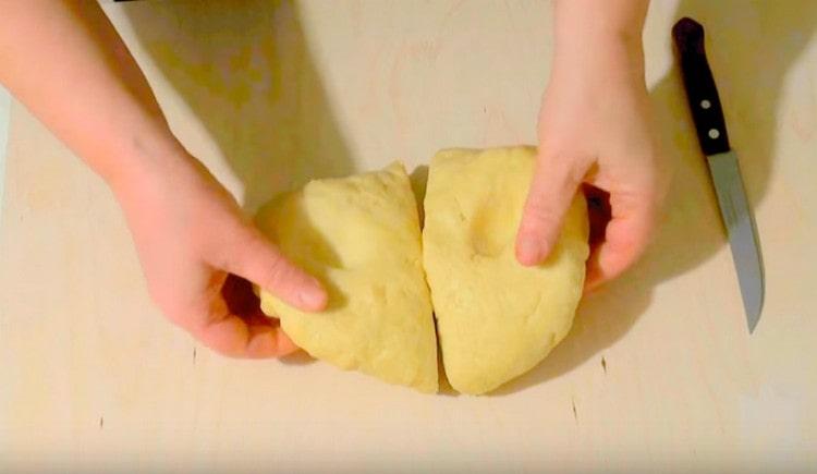 We divide the prepared dough in half.