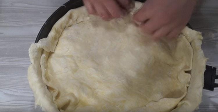Carefully pinch the edges of the dough.