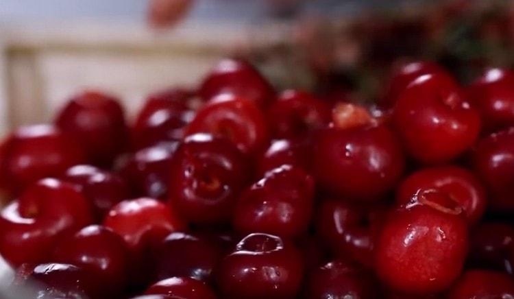 put cherries on a napkin or paper towel.