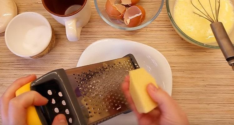 Rub the cheese on a fine grater.