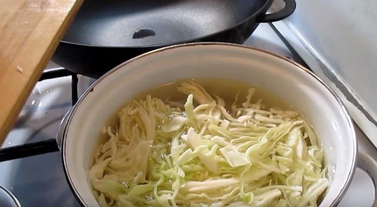 Boil the cabbage for several minutes, and then throw it into a colander.