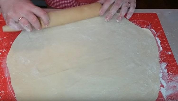 Thinly roll out most of the dough.