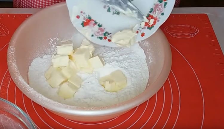 Add slices of butter to flour and mash into a crumb with a fork.