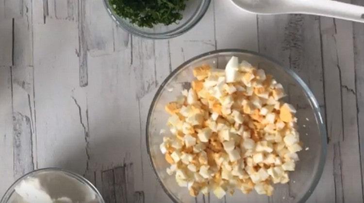 Hard-boiled eggs, cool. clean, cut into a cube.