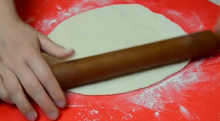 Roll out the second piece of dough with a slightly smaller diameter.